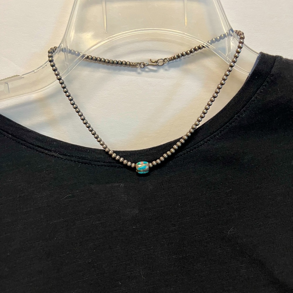 Navajo beads with Turquoise slider. Necklace is 16”.